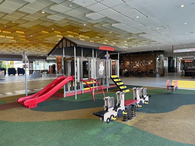 Cached playground photo showing roof or canopy cover: Playground at E!Avenue
