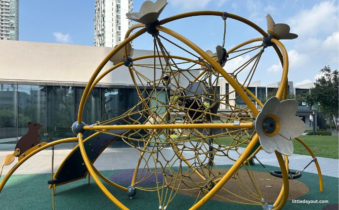 Yellow flower-shaped climbing sphere on Aperia Mall’s outdoor Level 3 deck