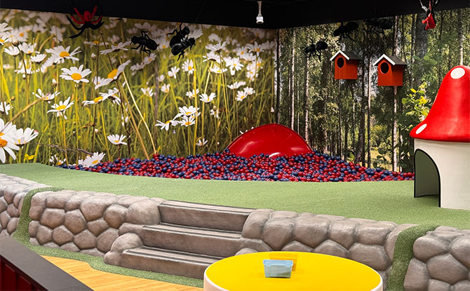 Ball pit, mushroom playhouse and forest wall mural at IKEA Alexandra Småland.