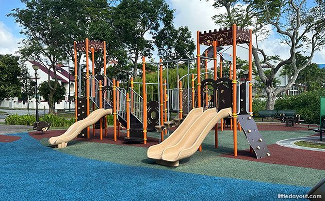 Pirate-themed climbing towers, connecting obstacles and slides beside the Bedok Canal.
