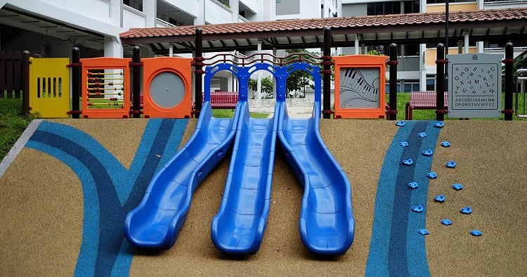 Three blue slides and activity panels at Block 180 Bukit Batok West Avenue 8 playground, in a photo published in 2019.