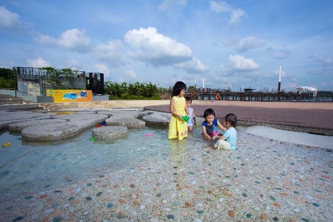 Children in the shallow water-play area at Lower Seletar Reservoir Family Bay