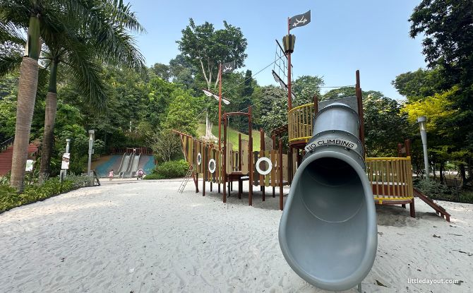 Wooden ship playground and enclosed slide in the sand at Jubilee Park, Fort Canning.