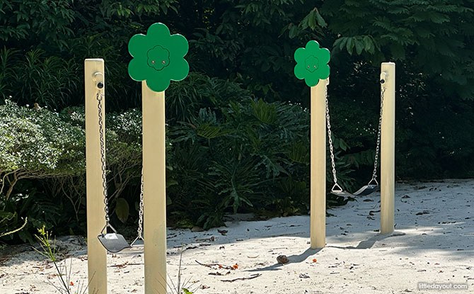 Two hammock swings over sand at the Sandy Hollow in HortPark Nature Playgarden