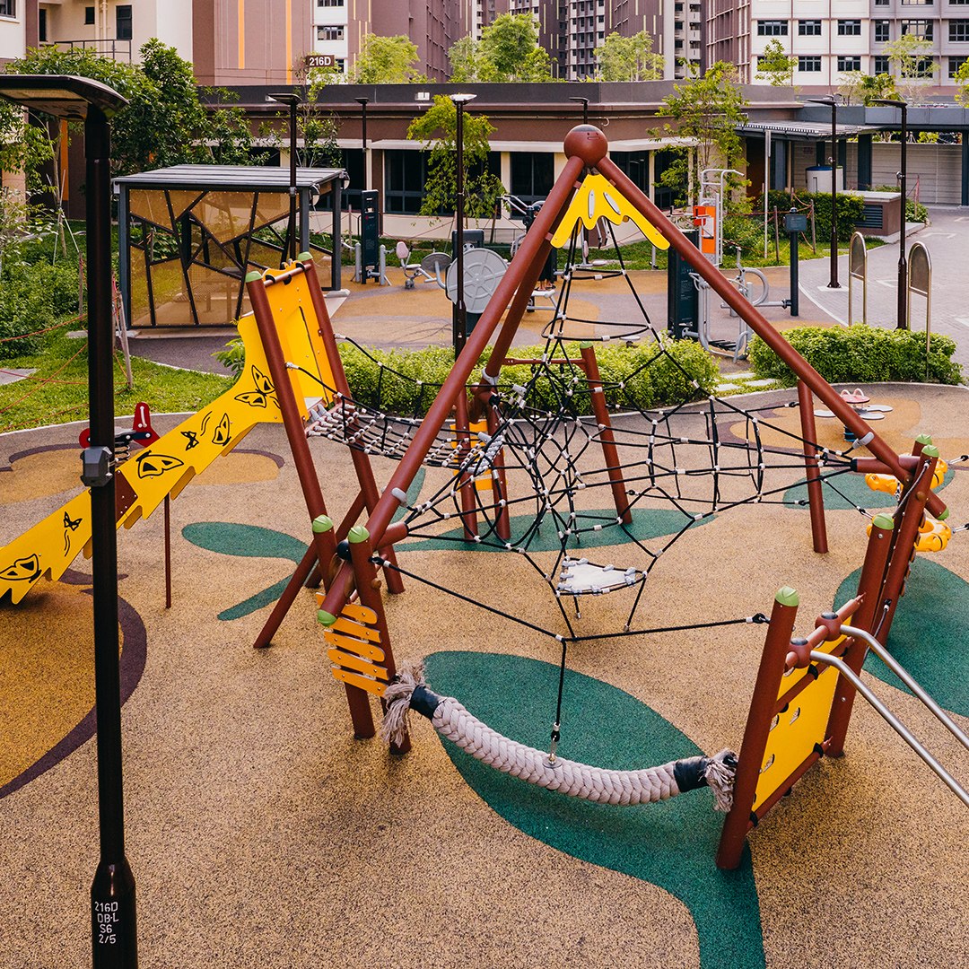 Rope pyramid, butterfly slide and suspended steps at Garden Waterfront II.