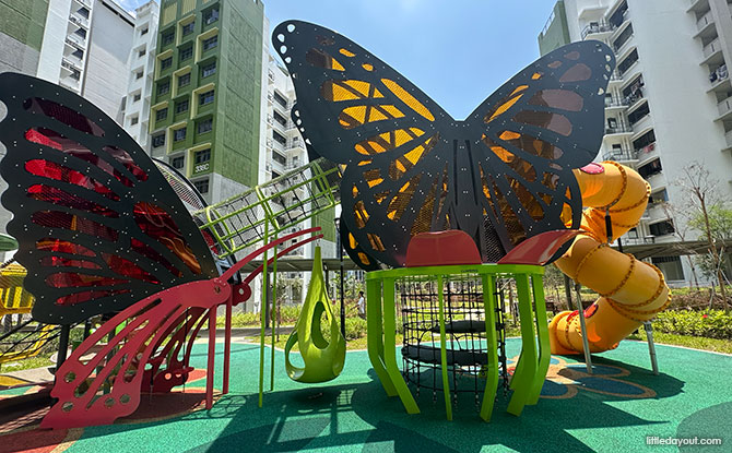 Butterfly wings, climbing platforms and a yellow slide at Yishun Boardwalk.