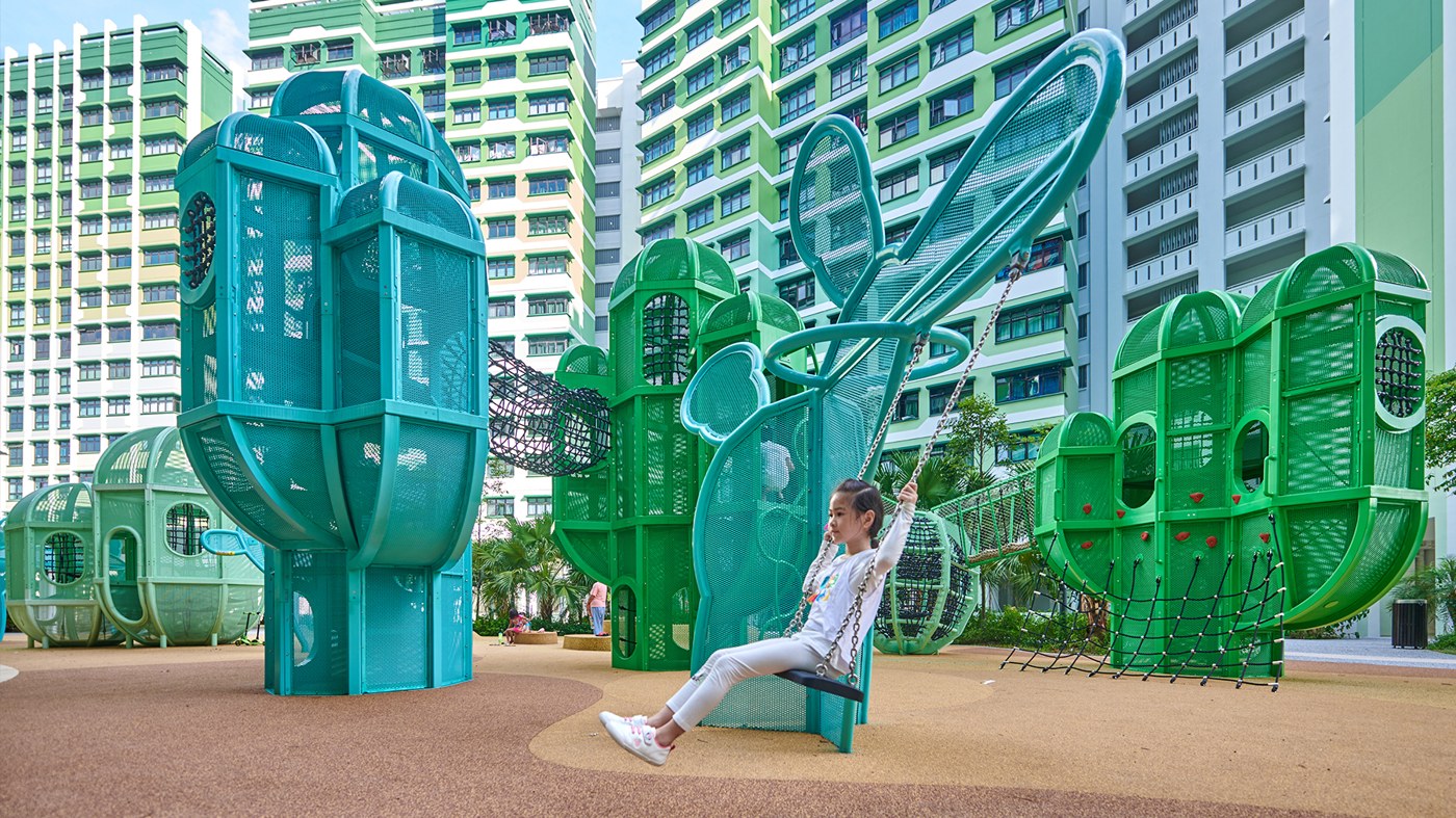 Green and turquoise cactus-shaped climbing towers, rope bridges and a swing at Tampines GreenDew